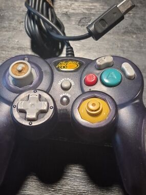 Wired Game Controller in Purple with Teal and Yellow Buttons
